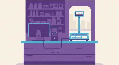 Ilustración de una balanza Systel Croma con mástil sobre el mostrador de un almacén, conectada por cable serie a una PC